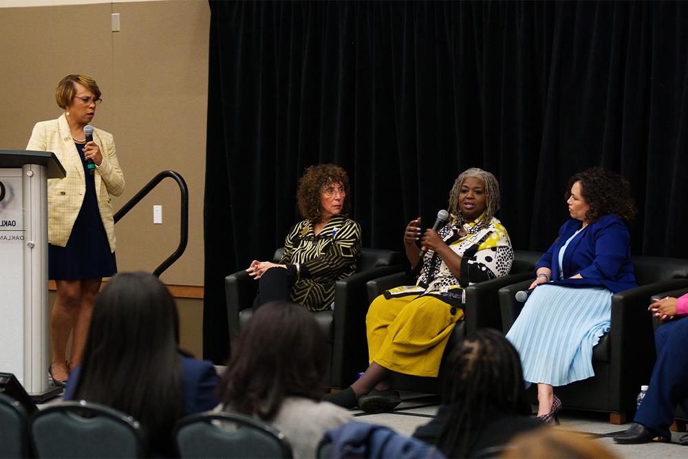 An image of a panel being moderated by Sophia Nelson